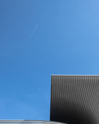 Low angle view of building against blue sky