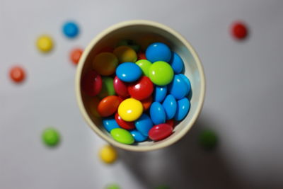 High angle view of multi colored candies on table