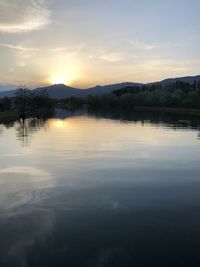 Scenic view of lake against sky during sunset