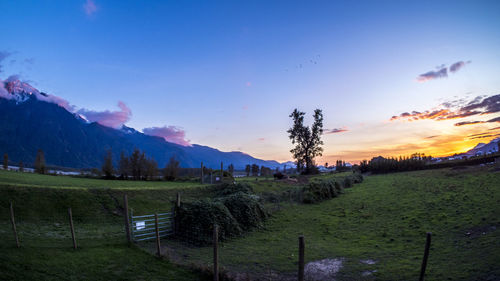 Scenic view of landscape against sky during sunset