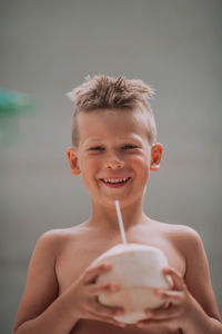 Portrait of a smiling man holding drink