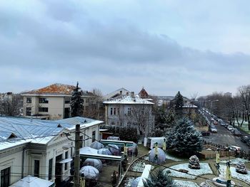 High angle view of houses and buildings against sky