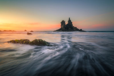 Scenic view of sea against sky during sunset