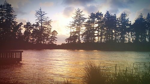 Scenic view of lake at sunset