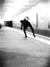 Blurred motion of people walking on road