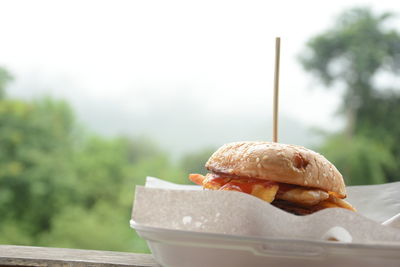 Close-up of burger on table outdoors