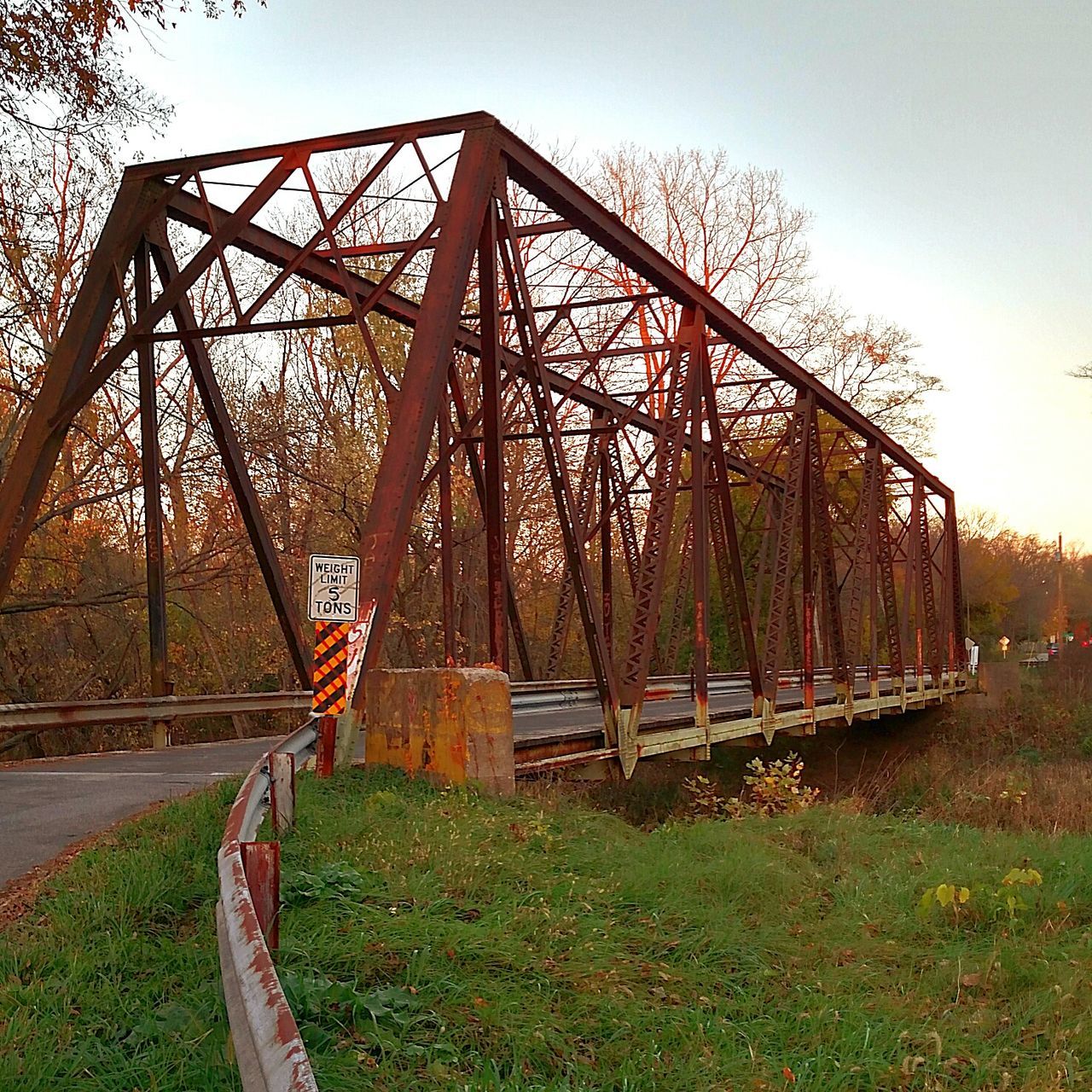 VIEW OF BRIDGE AGAINST TREES