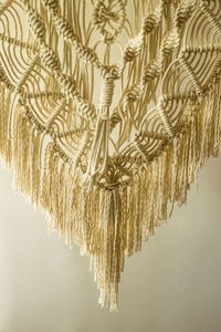 Macrame panel decor made of cotton cord. wicker hand made modern scandinavian interior decoration