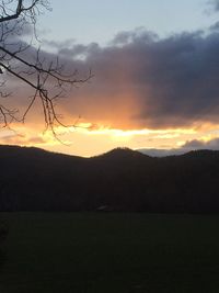 Silhouette landscape against sky during sunset