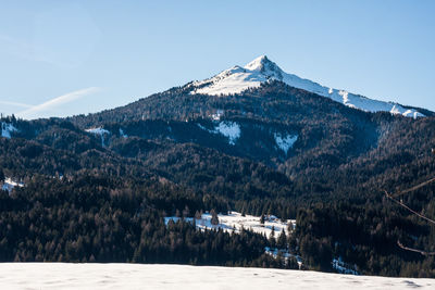 Scenic view of snowcapped mountains against sky