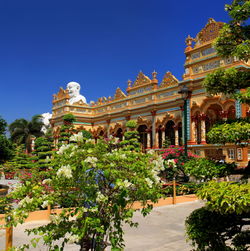 Low angle view of building against clear blue sky