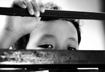 Close-up portrait of woman holding camera