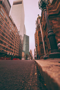 Road in city against sky