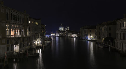 View of buildings in city at night