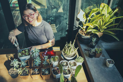 High angle portrait of woman planting
