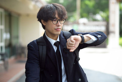 Portrait of young man using mobile phone