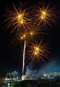 Bright colorful fireworks on black sky night background