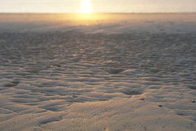 Scenic view of beach against sky during sunset