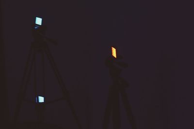 Low angle view of illuminated lights at night