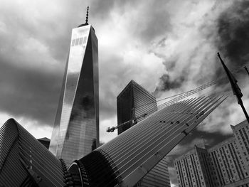 Exterior of one world trade center against cloudy sky