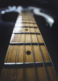 Close-up of guitar on table