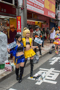 People standing on street in city