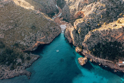 High angle view of rocks on sea