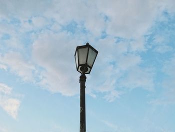 Low angle view of street light against sky