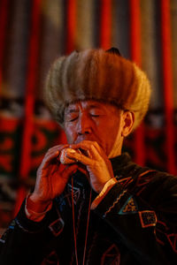 Close-up portrait of man wearing mask