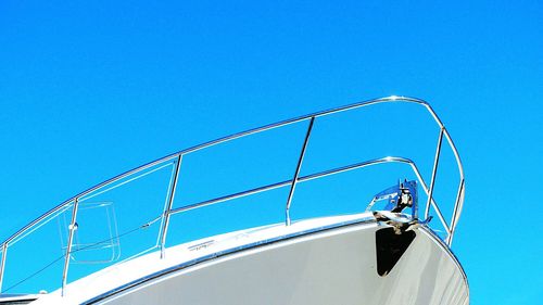 Low angle view of mast against clear blue sky