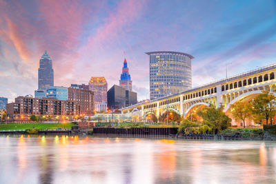 Bridge over river with buildings in background