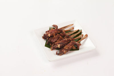 High angle view of meat in plate on table