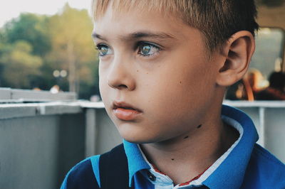 Close-up of thoughtful boy looking away at restaurant