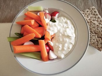 High angle view of chopped vegetables in bowl on table