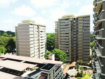 Buildings in city against sky