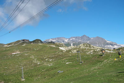 Scenic view of mountains against blue sky