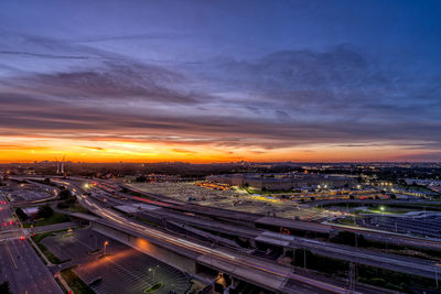 High angle view of illuminated pentagon cityscape against sky during sunset
