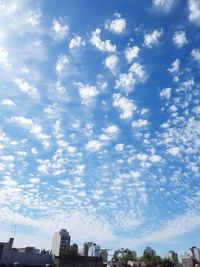 Low angle view of buildings against blue sky