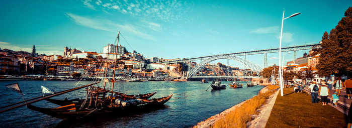 Boats in river with buildings in background