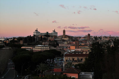 Panorama of rome from the orange garden on the aventine at sunset.