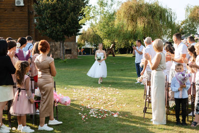 Group of people walking on field