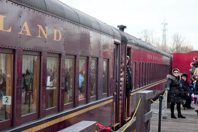 Train at railroad station against sky