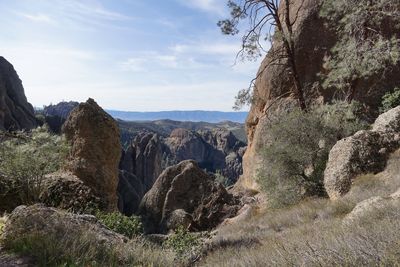 Rock formations on landscape against sky