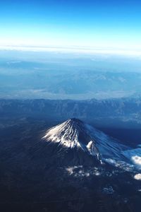Aerial view of volcanic landscape against sky