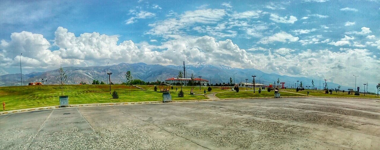 cloud - sky, sky, mountain, scenics - nature, landscape, beauty in nature, day, road, environment, nature, transportation, tranquil scene, mountain range, field, tranquility, land, outdoors, plant, airport, no people