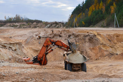 View of construction site on land against sky