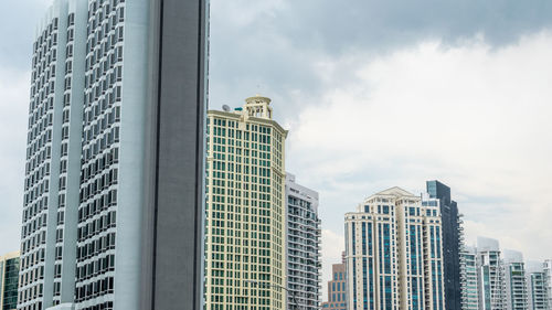 Low angle view of modern buildings against sky