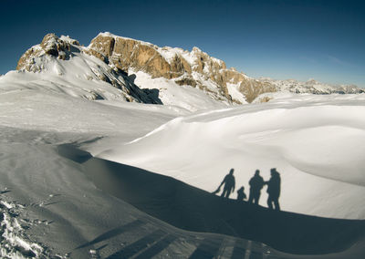 Sunny day on dolomites, hiking on altopiano della rosetta on winter