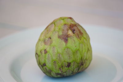Close-up of fruit in plate on table