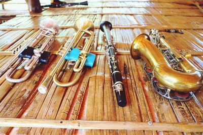 High angle view of piano keys on wooden floor